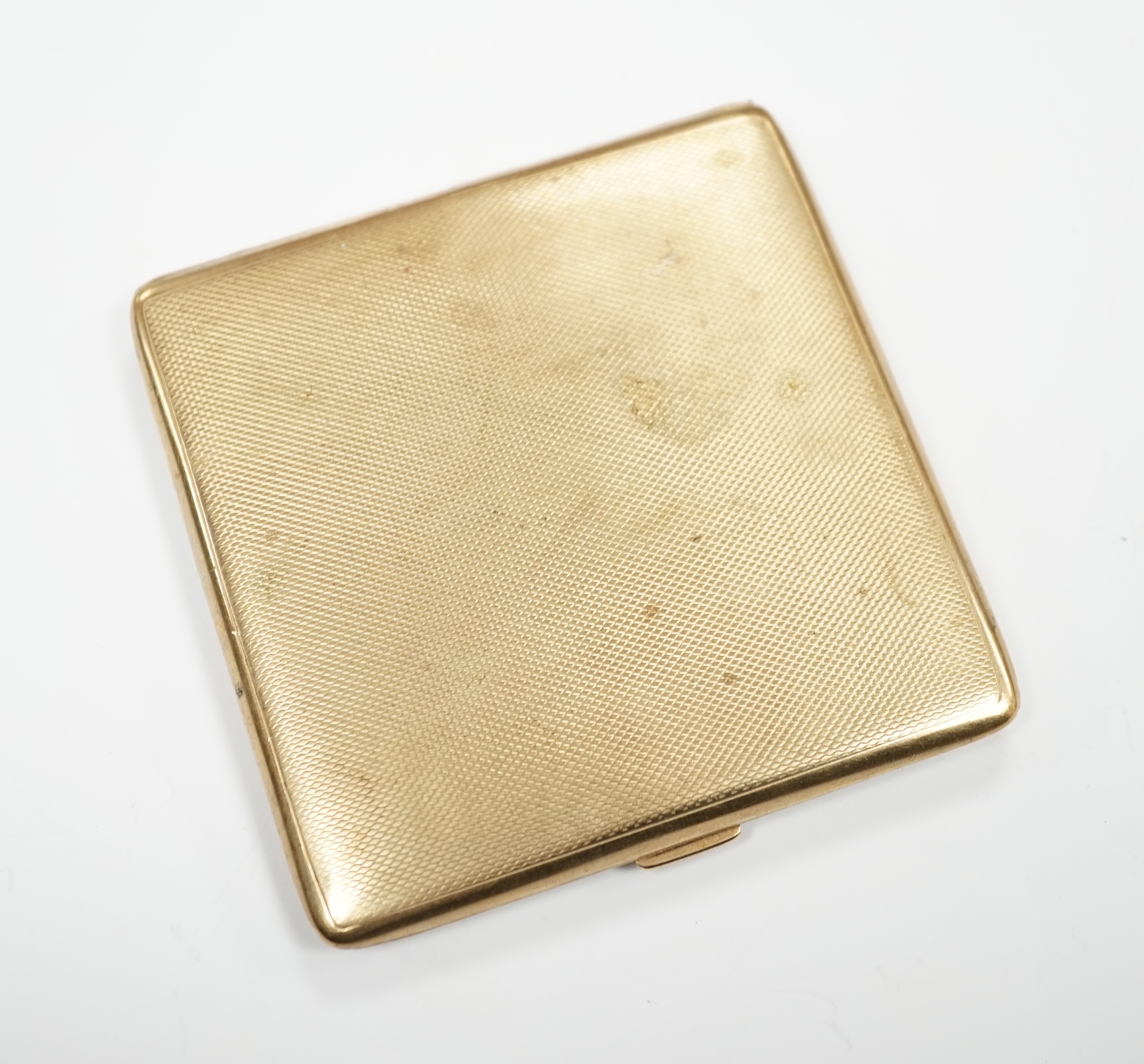 A George V square engine turned 9ct gold cigarette case by S. Blanckensee & Sons Ltd., Birmingham, 1928, 85MM, gross weight 106 grams.